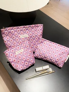 Large capacity purple floral jacquard makeup bag set for women portable travel storage.
