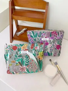 Floral embroidered cosmetic bag detail showing intricate threadwork and durable zipper.
