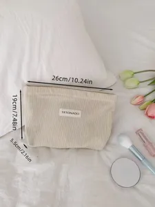 Detailed close-up view of the solid color corduroy makeup bag with clear size measurements.