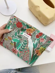 Close-up detail of the woven floral cosmetic bag showing embroidery texture and zipper closure.