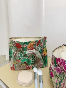 Large capacity floral embroidered cosmetic bag for travel, portable makeup pouch and toiletry bag.