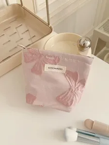 Trousse de maquillage rétro rose avec nœud pour le rangement, pochette portable.