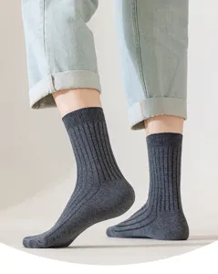 Close-up detail of men's cotton ribbed crew socks in dark grey, featuring comfortable fit.