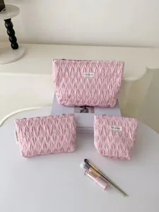 Pink quilted cosmetic bag set, large capacity portable makeup pouch for travel and daily use.