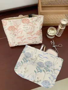 Portable large capacity cosmetic bag fresh floral makeup pouch for travel and daily use.
