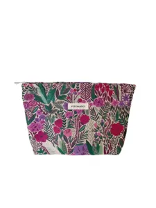 Close-up detail of the vintage woven floral tapestry cosmetic bag with front brand label.