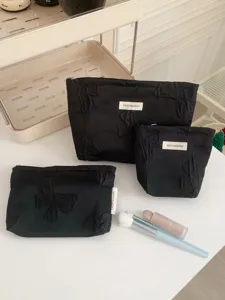 Set de trousses de maquillage noires a noeud, grande capacite pochette de rangement pratique.