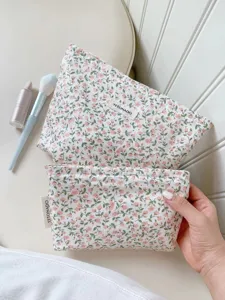 Detail view of the vintage floral cotton makeup bag showing neat stitching and cute design.