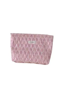 Pink quilted cosmetic bag with heart texture, portable clutch makeup organizer pouch for travel.
