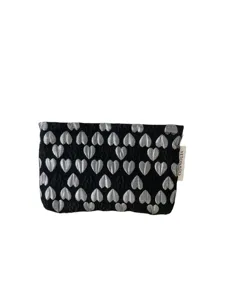 Black cosmetic pouch with silver heart pattern, portable makeup bag and toiletry organizer.