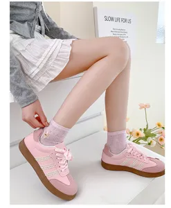 Pink casual sneakers and cute embroidered bear socks for women, stylish footwear style.