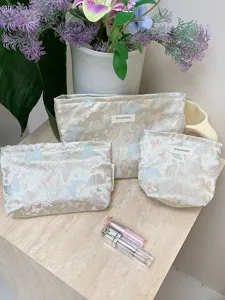 Detailed view of the aesthetic jacquard butterfly cosmetic bag set, portable storage pouch.