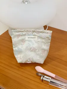 Jacquard butterfly cosmetic bag, portable travel storage pouch for daily makeup and essentials.