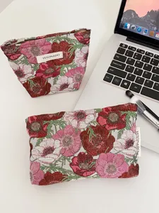 Floral jacquard cosmetic pouch detail, vintage flower makeup bag, portable storage clutch.