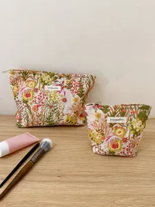 Canvas cosmetic storage bag set with embossed floral design, large capacity zipper pouch.