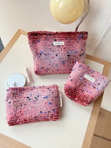 Cute tweed cosmetic bag set for women, portable makeup organizer and travel wash pouch.