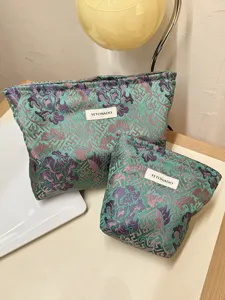 Detail view of Chinese vintage style cosmetic storage bags with peony pattern and woven label.
