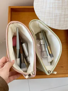 Detailed view of the large capacity corduroy cosmetic bag showing spacious interior and compartments.