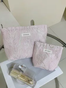 Pink embossed cosmetic bag set, large capacity portable travel wash bag and storage organizer.