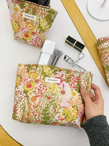Floral canvas makeup pouch with zip closure, spacious cosmetic storage bag for daily use.