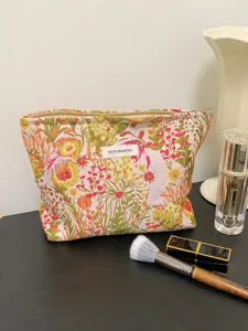 Detailed view of floral canvas cosmetic makeup bag with zipper and large storage capacity.