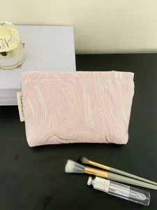 Pink jacquard cosmetic bag with gold texture, portable large capacity makeup pouch for travel.
