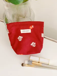 Red Christmas cosmetic bag with cute embroidery, portable makeup pouch for daily travel use.