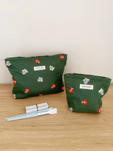 Christmas canvas cosmetic bag with cute embroidery, portable storage pouch for travel toiletries.