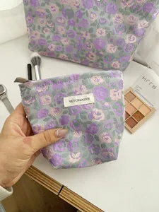 Floral jacquard cosmetic bag with zipper, portable makeup pouch and travel toiletry organizer.