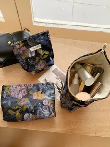 Large capacity floral cosmetic bag, portable travel pouch and toiletry organizer for daily use.