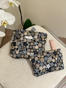 Floral jacquard fabric cosmetic bag set, portable travel makeup pouch and toiletry storage.