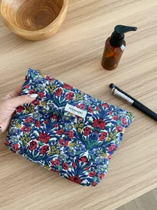 Vintage floral cosmetic bag for women, portable travel makeup pouch and toiletries organizer.