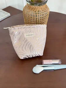 Pink gold textured striped makeup pouch cosmetic bag for travel daily personal storage.