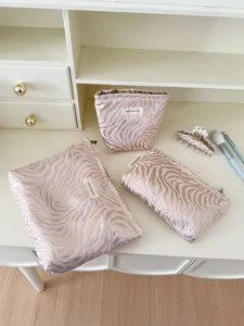 Zebra patterned cosmetic bag set, embossed large capacity makeup pouch and toiletry organizer.