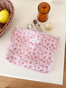 Cute pink floral makeup bag for women, portable cosmetic storage pouch and toiletry organizer.