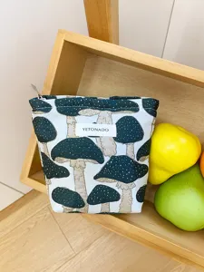 Portable canvas makeup bag with cute mushroom pattern, ideal cosmetic storage pouch for travel.