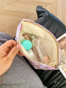 Portable floral pattern cosmetic pouch for travel, elegant storage bag for daily makeup essentials.