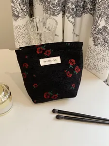 Black woven floral makeup pouch with YETONADO label, stylish daily cosmetic bag for women.