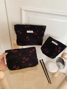 Black rose jacquard cosmetic bag detail, convenient daily makeup pouch set with zipper.