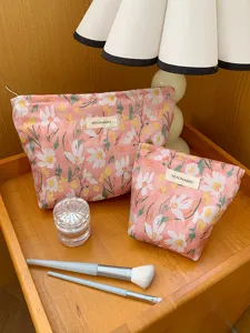 Floral embroidered cosmetic bag set of two, portable travel makeup storage pouch for women.