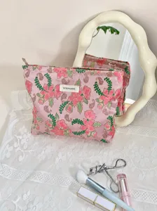 Pink floral embroidered cosmetic bag, portable jacquard makeup pouch and handy storage bag detail.