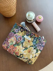 Vintage embroidered floral cosmetic bag detail, large capacity fabric makeup pouch, portable.