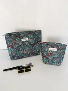 Dragon pattern brocade cosmetic bag set detail view, portable makeup storage pouch.