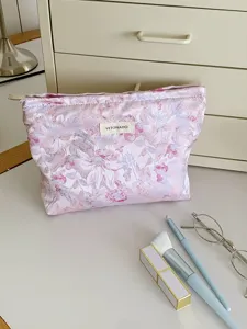 Floral makeup pouch detail view, large capacity cosmetic bag and portable toiletry storage case.