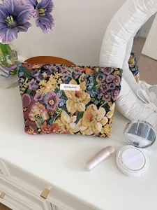 Vintage floral tapestry cosmetic bag detail, large capacity fabric makeup pouch for travel.