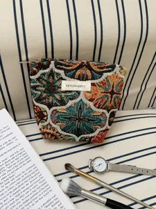 Vintage large capacity cosmetic bag, portable travel storage pouch for toiletries and makeup items.