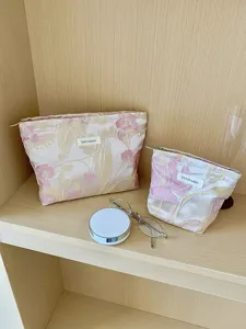 Gold thread floral jacquard cosmetic bag set, pleated texture portable makeup storage pouch.