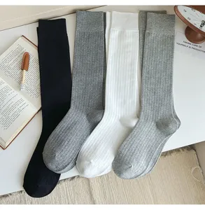 Detail view of solid color ribbed long socks in various classic colors, comfortable.