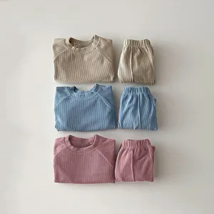 Children ribbed long sleeve top and pants set detail view, soft knit toddler outfit style.