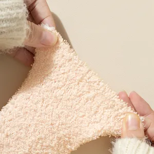 Thick coral fleece winter socks for women, super soft plush floor socks with warm fabric detail.